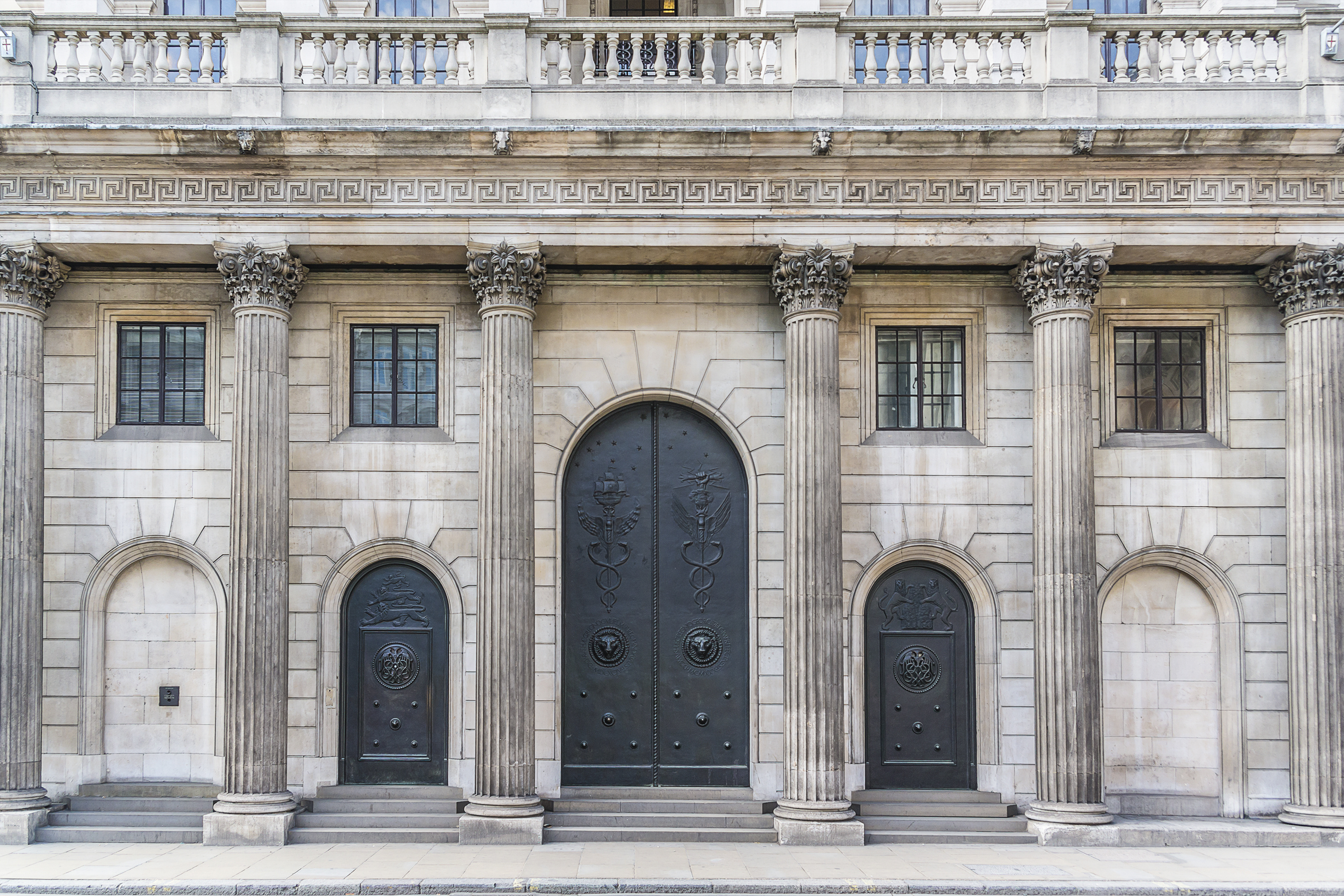 Classical London building façade with stone columns and ornate doors